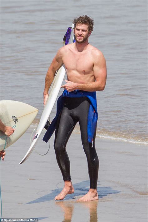 liam hemsworth shows off his torso and ripped abs while surfing in australia daily mail online