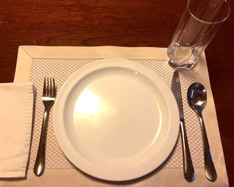 Put the dinner plate in the middle of the placemat. Table Setting Etiquette