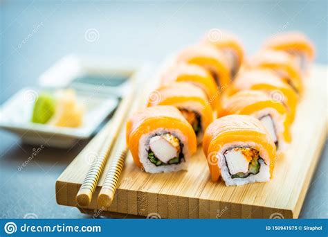 Best serve while hot and with dip. Salmon Fish Meat Sushi Roll Maki On Wood Plate Stock Image - Image of cheese, japan: 150941975