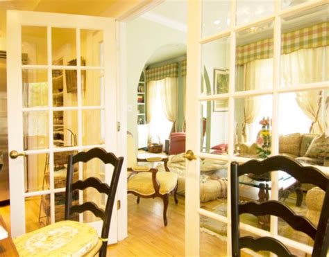 Patio doors are dressed in a stark white finish and a traditional perspective. Inside And Out, Where To Use French Doors