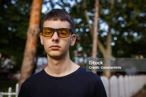 Portrait Of Caucasian Teenage Boy Looking At Camera While Wear