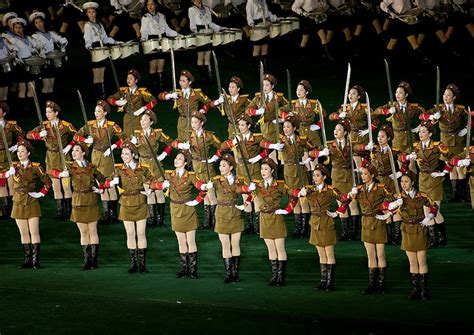 Sexy North Korean Women Dressed As Soldiers Dancing With Swords During The Arirang Mass Games In