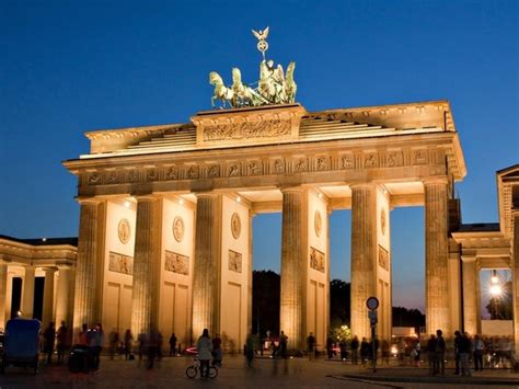 Photo of the brandenburg gates in berlin, germany after the bombing of wwii. How did historical German landmarks such as the ...