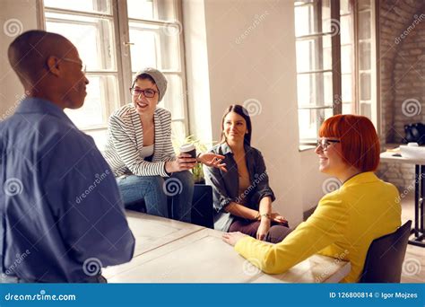 Female Workers In Office Talking With Male Manager Stock Photo Image