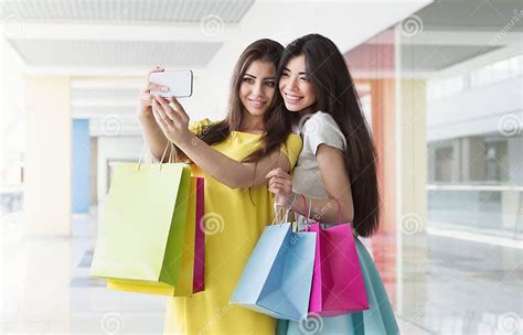 happy girls taking selfie while shopping in mall stock image image of buyers asian 124870681