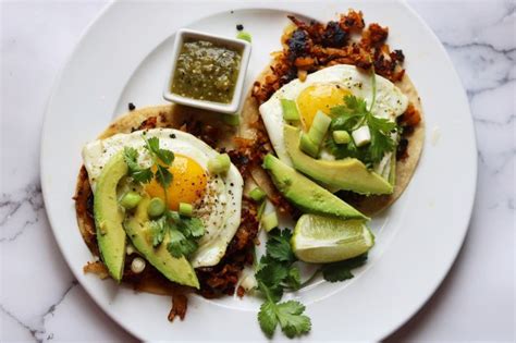 awesome chorizo breakfast tacos with potato hash and fried eggs