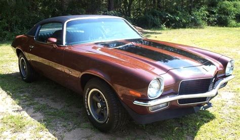 Spray painting is an inexpensive way to paint a car. Example of Burnt Orange paint on a GM 1971 Chevrolet ...