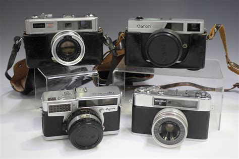 A Collection Of Assorted Cameras Including A Minolta Super 3 Circuit