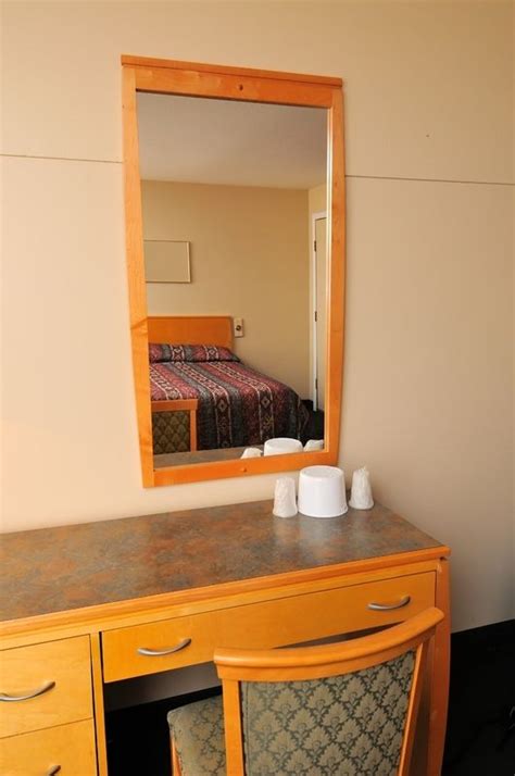 Typical And Generic Dressing Area In Bedroom With Mirror Furniture
