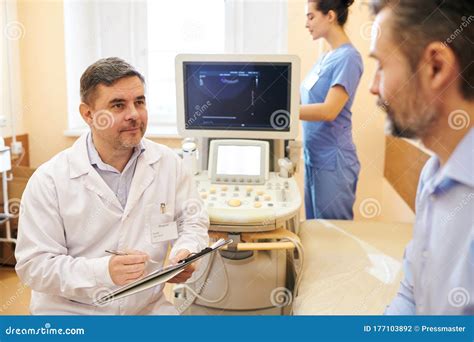 Doctor Answering Patients Questions Stock Photo Image Of Confidence