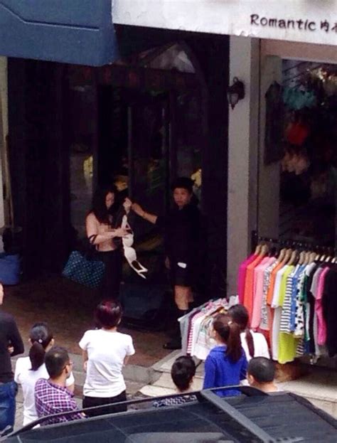 Toplifting Female Thief Left Topless After Being Caught Stealing By Merciless Store Owner