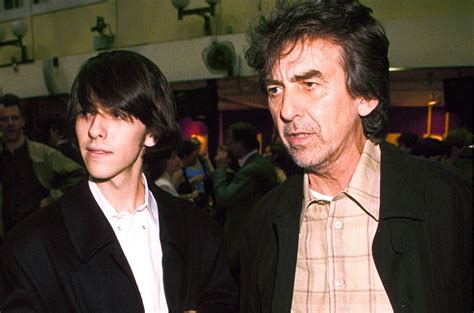 George Harrison And Son Dhani Photographed At A Guitar Auction At Christies In London In