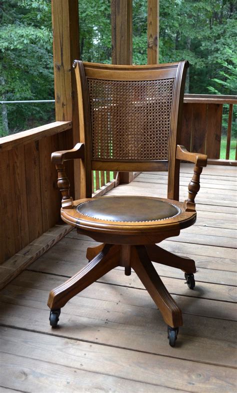 Vintage Wood Oak Office Chair Swivel Wheels Cane Back Vinyl Seat