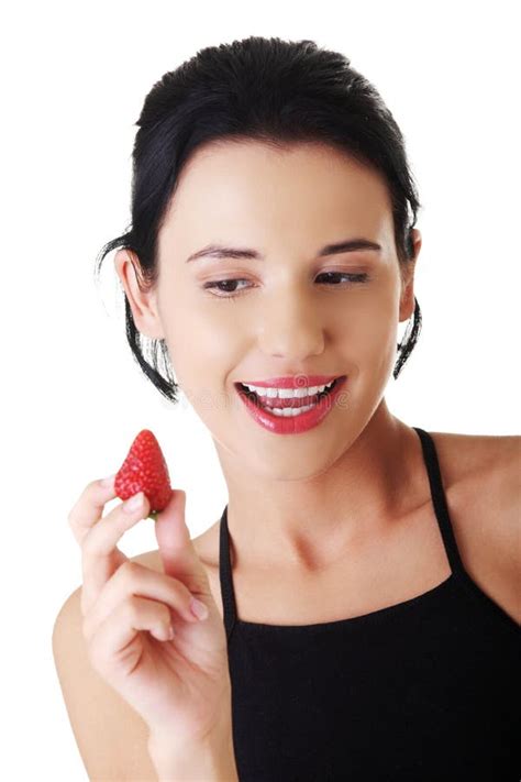 Portrait Of A Woman Eating Strawberry Stock Photo Image Of Sportswear
