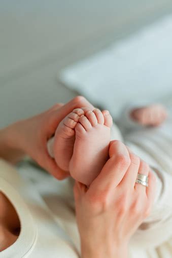 Closeup Babys Legs Beautiful Young Happy Mom And Baby Mom Holds The