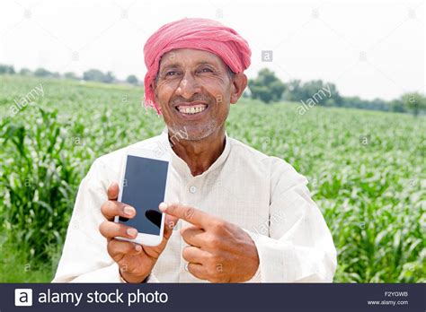 1 Indian Rural Senior Farmer Farm Mobile Phone Quality Showing Stock