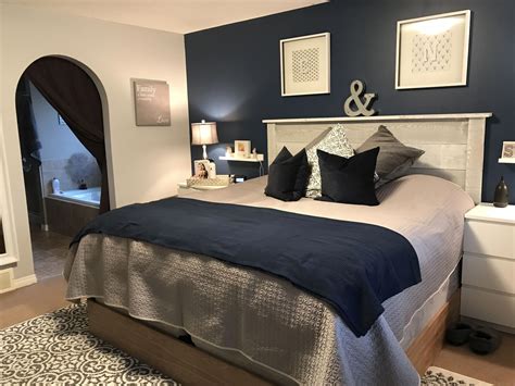 The space is one where you can go to and get away from it all. Navy Blue Master Bedroom Makeover #Homedecorbedroom ...