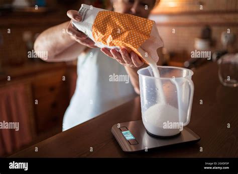 Weighing Sugar Pouring Scales Hi Res Stock Photography And Images Alamy