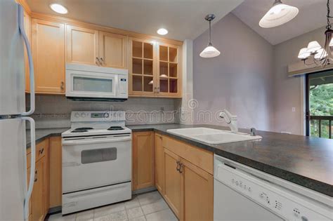 Gray kitchens with maple cabinets. Tidy Compact Kitchen With Maple Cabinets Stock Image ...