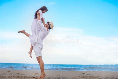 Happy Romantic Couples Lover Holding Hands Together Walking On The Beach Stock Image Image Of