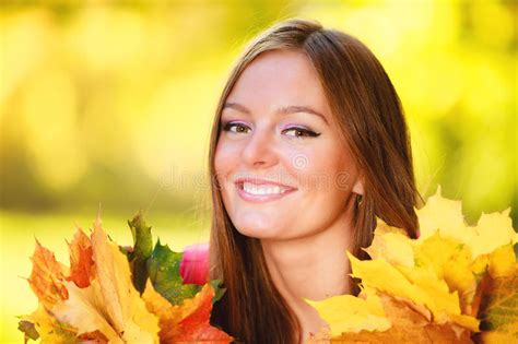 Fall Season Portrait Girl Woman Holding Autumnal Leaves In Park Stock