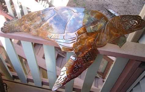 For kids' rooms, decorate with cool illusion stickers that make it look like 3d superheroes or cartoon characters are busting through the wall, or add a 3d window sticker to a drab wall that makes it look like you have a seaside view. Turtle, Turtle Metal Art, Wall Turtle, Sea Turtle