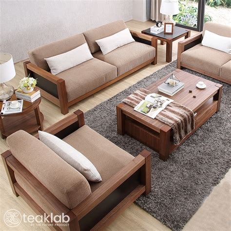 The futon sofa bed design featured here is simple, natural and cosy with its light coloured wooden base and comfy cotton upholstery. Buy Indian Minimalist Wooden Sofa Set Online | TeakLab