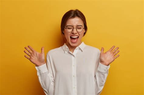 Free Photo Sincere Emotions And Feelings Concept Overjoyed Caucasian Woman Raises Palms