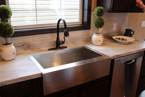 This is the place that everyone visits. Counters are Sea Pearl Laminate and this kitchen features ...