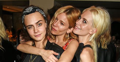 Cara Delevingne Sister Poppy And Sienna Miller Cosy Up At The Celeb Packed Love Christmas Party