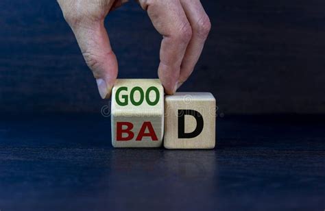 Good Or Bad Symbol Businessman Hand Turns A Cube And Changes The Word