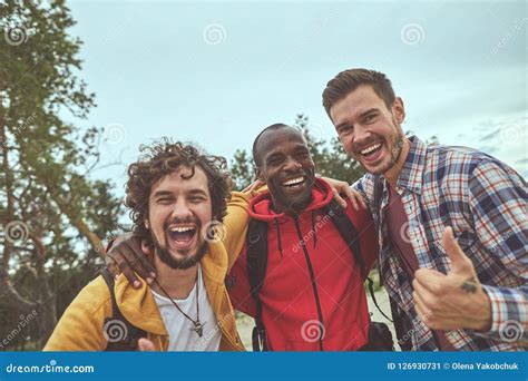 Happy Young Guys Are Hugging Each Other Stock Image Image Of Journey