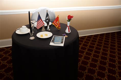12 silk rose with 6 glass vase & red ribbon. POW-MIA ceremony marks sad benchmark > Marine Corps ...