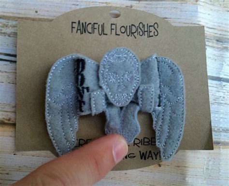 This cute weeping angel is made in 7 pieces: Weeping Angel inspired Hair Bow by Fancifulflourishesfa on ...