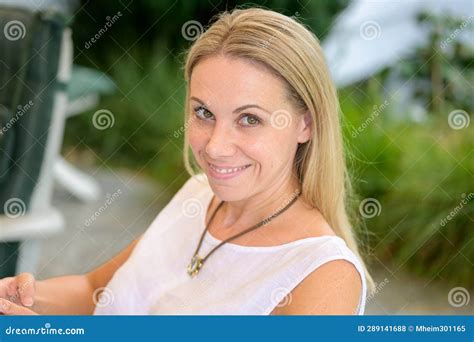 Top View Of An Attractive Woman In Her Forties Looking Up Stock Photo