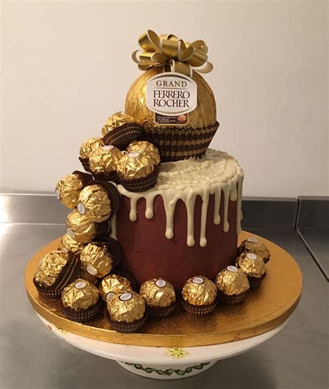 These ferrero rocher stuffed cupcakes from delish.com have such a fun inside! Ferrero Rocher Drip Cake (With images) | Drip cakes, Cake ...