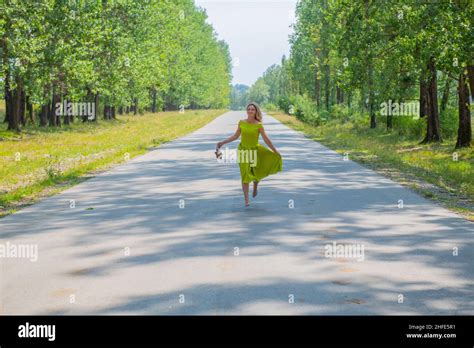 One Woman Running Barefoot Hat Hi Res Stock Photography And Images Alamy