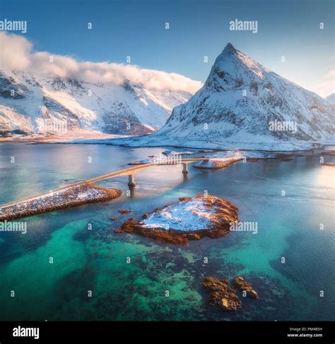 Aerial View Of Bridge Over The Sea And Snowy Mountains In Lofoten