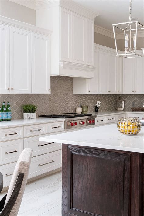 Neutral square mosaic glass tiles blend with granite countertops. Pin on Glass Kitchen Backsplash Tile Ideas