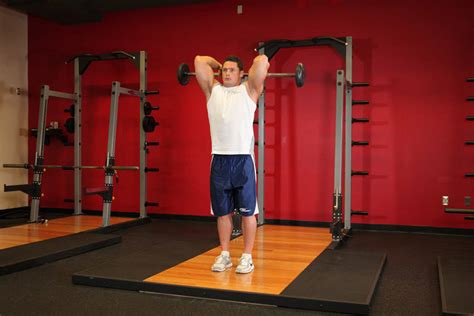 How to do a french press workout. Standing Overhead Barbell Triceps Extension Exercise Guide ...