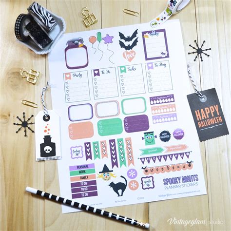 A Halloween Themed Planner Sticker Sheet On A Wooden Table With Other