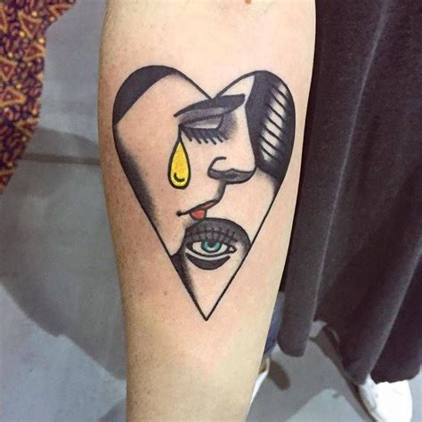 Heart Shaped Faces Tattoo On The Right Inner Forearm Love Tattoos