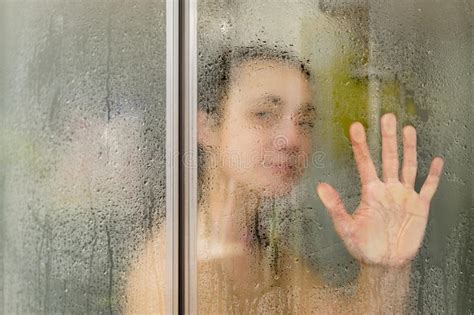 Beautiful Woman In The Shower Behind A Glass Door With Drops Woman