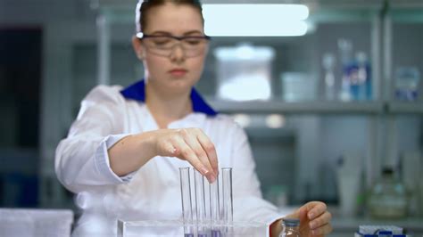 Woman Scientist Conducting Research In Chemical Lab Chemist Mixing