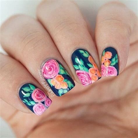 Flowers art on a white base. 7 Graceful Floral Nail Arts for Spring - NailDesignCode