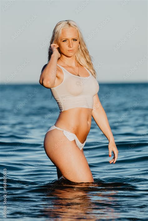 Sexy Woman In Wet T Shirt Playing On Water At Beach Over Sea Summer Time Stock Photo Adobe Stock
