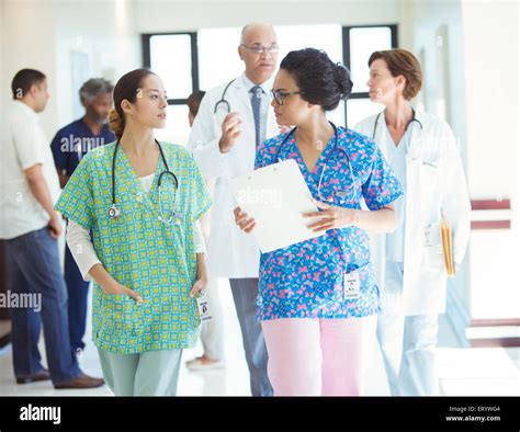 Nurses Talking In Hospital Corridor Stock Photo Alamy