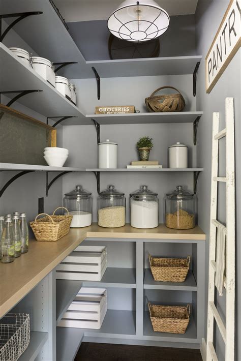 Blue Pantry Renovation With Plenty Of Storage Wood Shelving And Organized Glass Jars In
