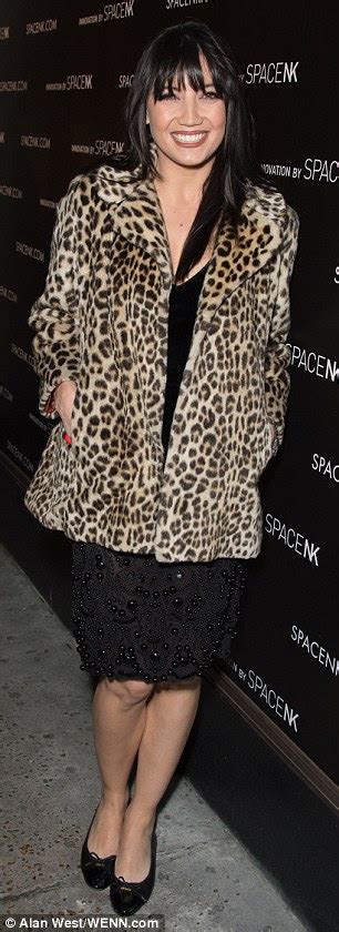 katching my i daisy lowe looks purr fect in a leopard print coat and chic black dress with her
