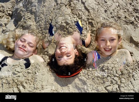 Three Young Girls Buried In The Sand At Skegness Lincolnshire England